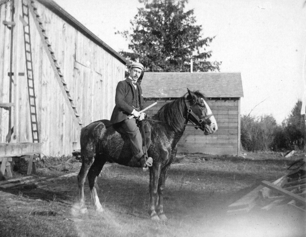 H. Harvey seated on horse